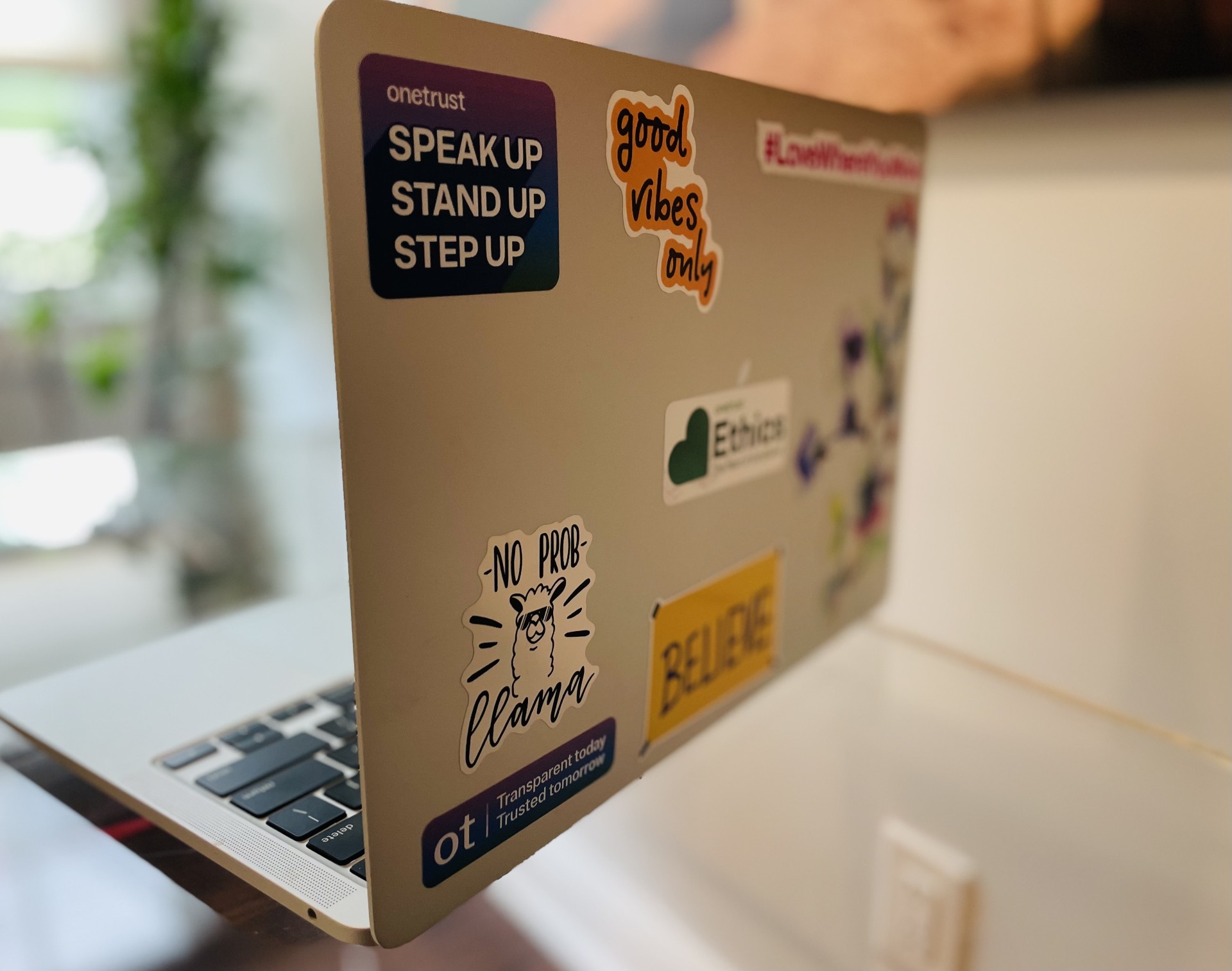 Side angle of laptop with stickers
